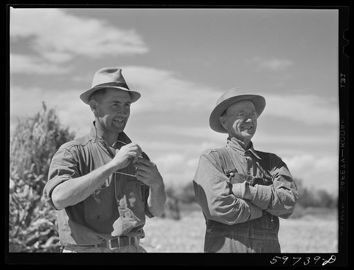 A.E. Scott and his son Charles on their farm northeast of Scottsbluff, Nebraska