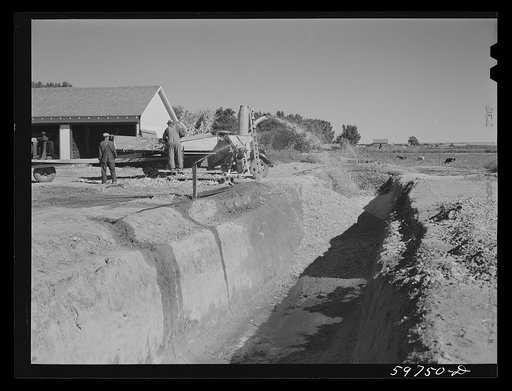 Untitled photo, possibly related to: Filling the trench silo on Scottsbluff Farmsteads, FSA (Farm Security Administration) project. Scottsbluff, Nebraska