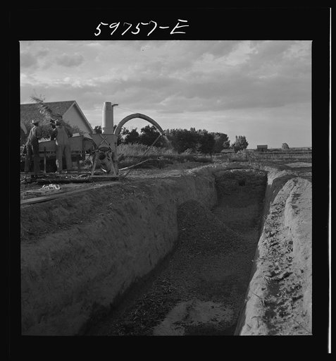 Untitled photo, possibly related to: Filling the trench silo on Scottsbluff Farmsteads FSA (Farm Security Administration) project. Scottsbluff, Nebraska