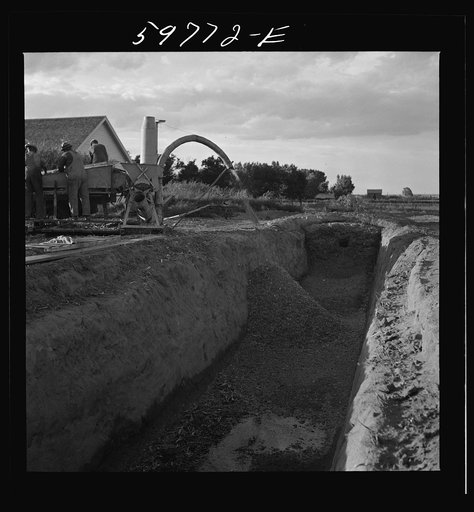 Untitled photo, possibly related to: Filling the trench silo on Scottsbluff Farmsteads FSA (Farm Security Administration) project. Scottsbluff, Nebraska