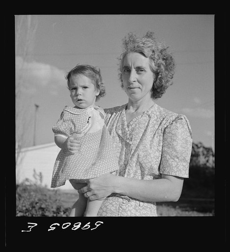 Wife and child of one of the members of the Two Rivers Cooperative Company, FSA (Farm Security Administration) project, with a neighbor at Waterloo, Nebraska