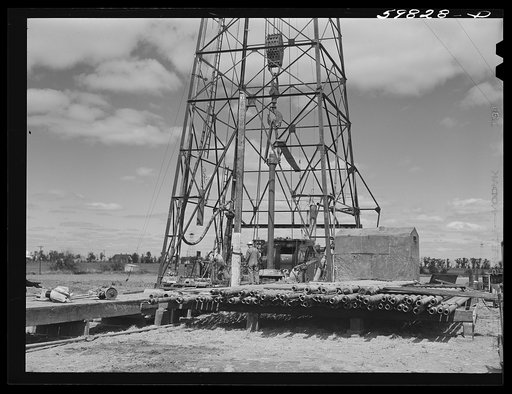 Preparing to drill an oil well in Goodrich field of Continental oil company. Valley Center oil field near Wichita, Kansas