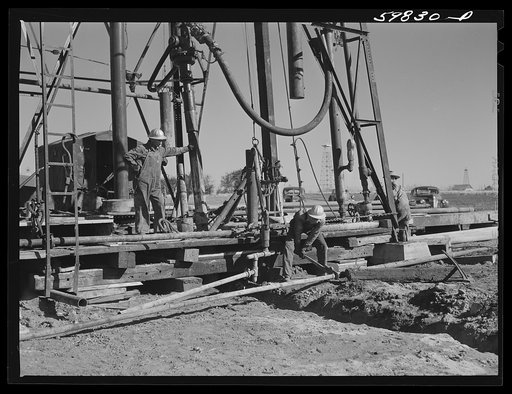 Preparing to drill an oil well in Goodrich field of Continental oil company. Valley Center oil field near Wichita, Kansas