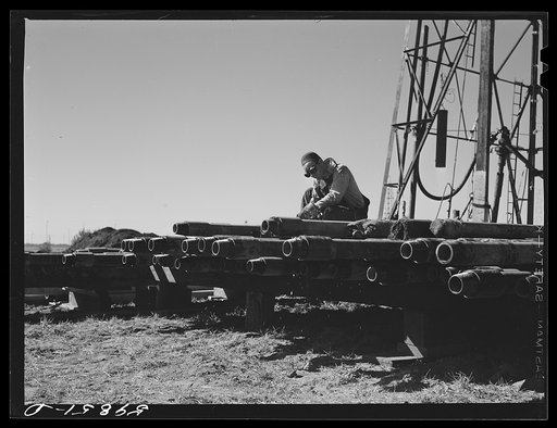 Untitled photo, possibly related to: Floyd Swick, welder from Newton, Kansas, worked in oil fields about ten years cutting tool joints off a drill pipe. In Goodrich field of Continental oil company. Valley Center oil field near Wichita, Kansas