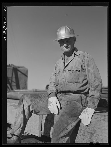 T.J. Schenermann, driller from Oklahoma. Worked in Kansas oil fields about fifteen years. By oil well being drilled in Goodrich field of Continental oil field near Wichita, Kansas