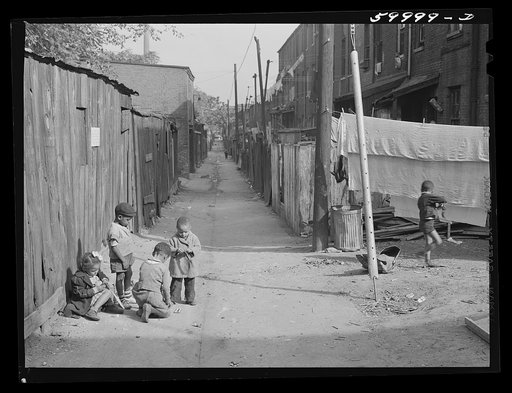 Children playing in De Frees Alley, N.E. Washington, D.C., near Capitol building. One basement room rents for nine dollars a month; two rooms upstairs for sixteen dollars;  one bath and cold water in the hall for entire building