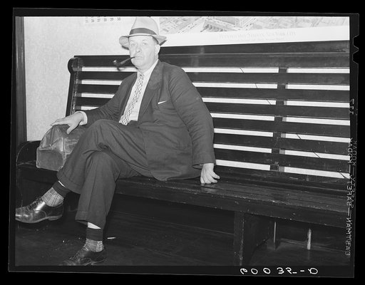 Man waiting for bus in hotel lobby. Elkins, West Virginia