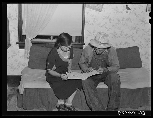 FSA (Farm Security Administration) rehabilitation borrower going over farm account book with his wife. Jackson County, Wisconsin