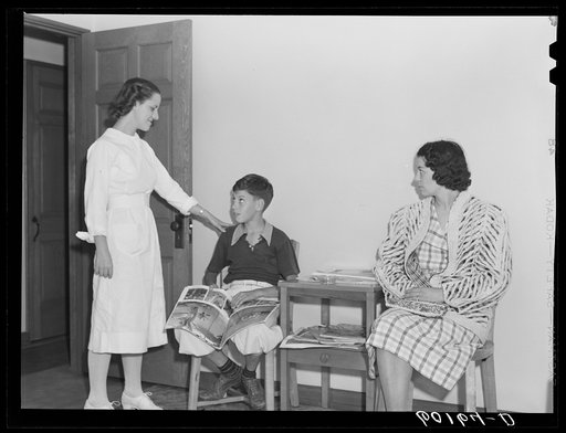 Untitled photo, possibly related to: Doctor examining boy's throat. Greendale, Wisconsin. This is the Greendale branch of the Milwaukee Group Health Association