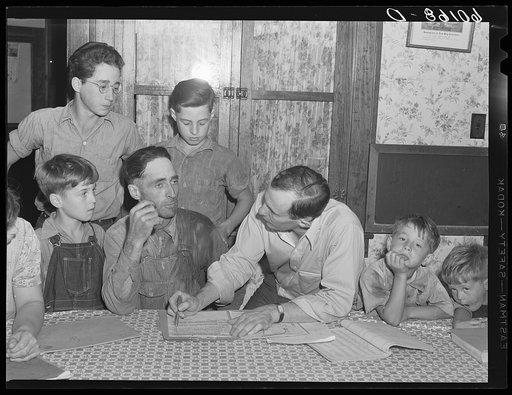 FSA (Farm Security Administration) county supervisor discussing farm plan with rehabilitation client. Grant County, Wisconsin