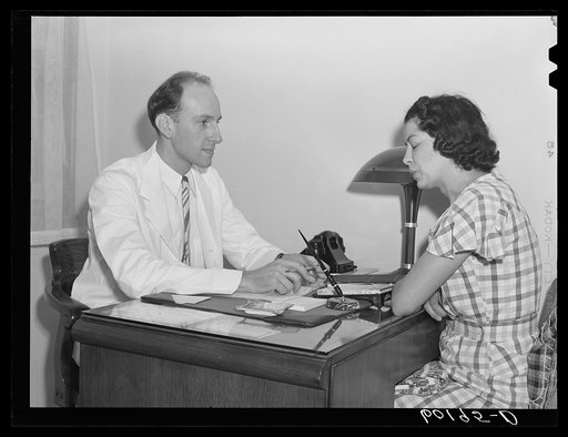 Untitled photo, possibly related to: Boy being examined by doctor. Greendale, Wisconsin. This is the Greendale branch of the Milwaukee Group Health Association