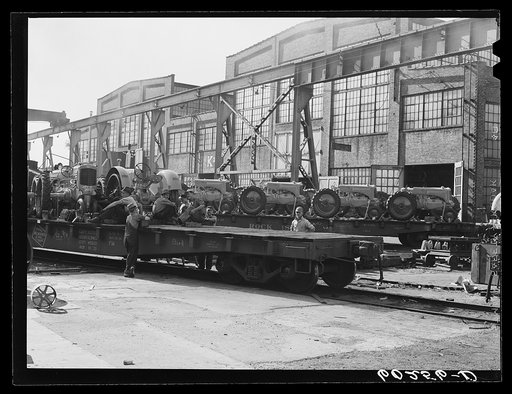 Untitled photo, possibly related to: Tractors on railroad cars at Minneapolis-Moline Company. Minneapolis, Minnesota