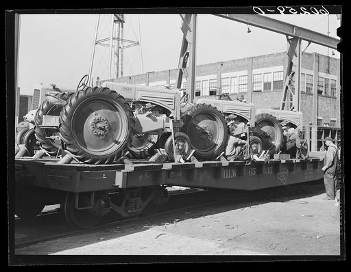 Loading tractors on railroad cars at Minneapolis-Moline Company. Minneapolis, Minnesota