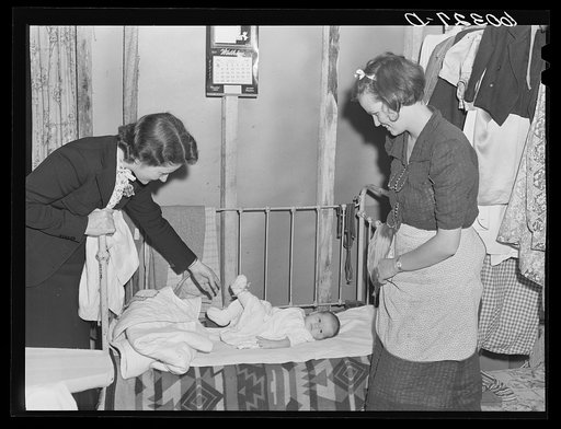 FSA (Farm Security Administration) home supervisor discusses child care problems with mother of month old baby, rehabilitation borrower. Chippewa County, Wisconsin