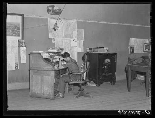 Editor of the Litchfield Independent at his desk. Litchfield, Minnesota