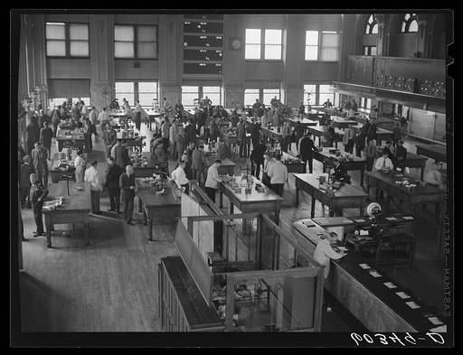 Minneapolis grain exchange, Minneapolis, Minnesota. This is the largest open grain market in the United States. Here actual samples of grain from freight cars are on the tables. On the other side of this room is the "pit" where bidding is on future markets