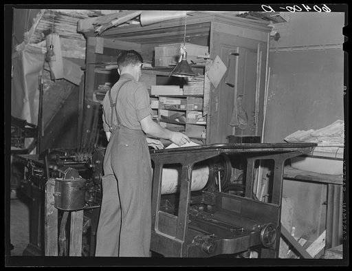 Operating press in office of Litchfield Independent. Litchfield, Minnesota