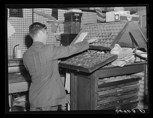 Setting type by hand. Litchfield Independent, Litchfield, Minnesota