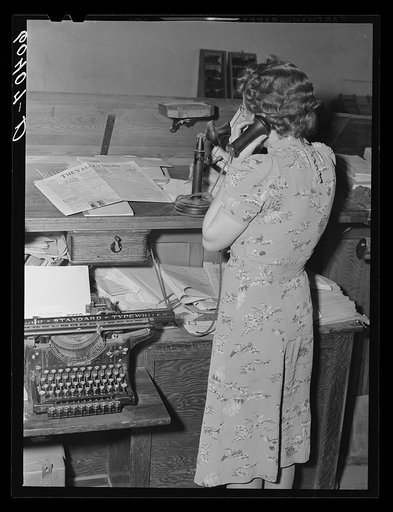Editor of the Valley News getting news by telephone. Browns Valley, Minnesota