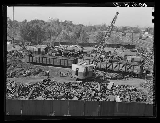 Loading scrap iron onto railroad cars. Minneapolis, Minnesota