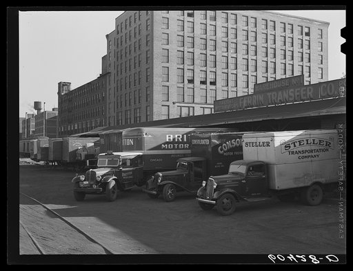 Trucks loading at terminal warehouse. Minneapolis, Minnesota