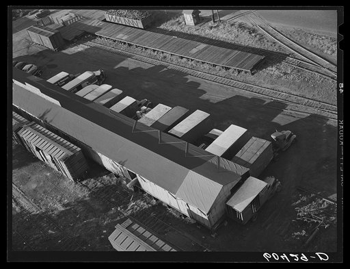 Trucks loading at terminal warehouse. Minneapolis, Minnesota