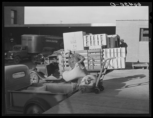 Loading trucks with sacks of salt. Minneapolis, Minnesota