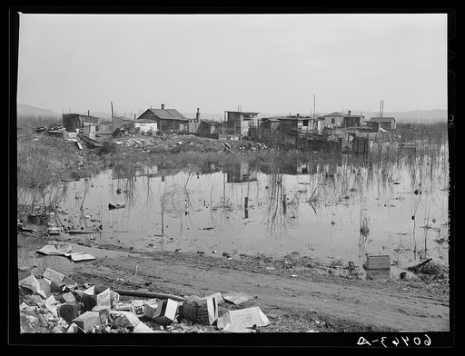 Shacktown adjoining city dump along riverfront. Dubuque, Iowa