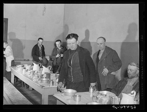 Men filing into dining hall at 5:00 p.m. for evening meal at Dubuque, Iowa, at city mission. Community chest-financed. Dubuque, Iowa
