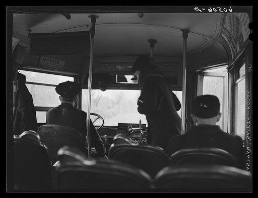 Boarding a bus. Dubuque, Iowa