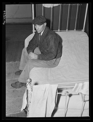 Transient farm laborer in hotel room which he rents for one dollar and fifty cents a week. Dubuque, Iowa