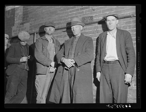 Transient men waiting in line for evening meal served at 5 p.m. at the city mission. Dubuque, Iowa