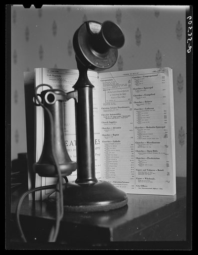 Untitled photo, possibly related to: Telephone and directory. Dubuque, Iowa