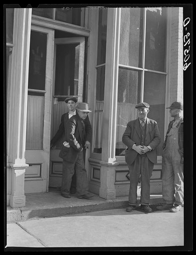 Men coming out of the city mission after evening meal. Dubuque, Iowa