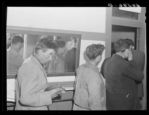 Transient men waiting to have their clothes fumigated and take showers. City mission, Dubuque, Iowa