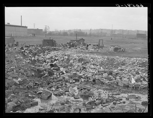 City dump. Dubuque, Iowa. In the background are shacks occupied by men who salvage anything marketable they can find in the dump
