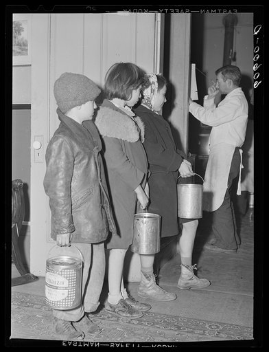 Children waiting in line for soup given out each night by the city mission, a community chest- financed organization. Dubuque, Iowa
