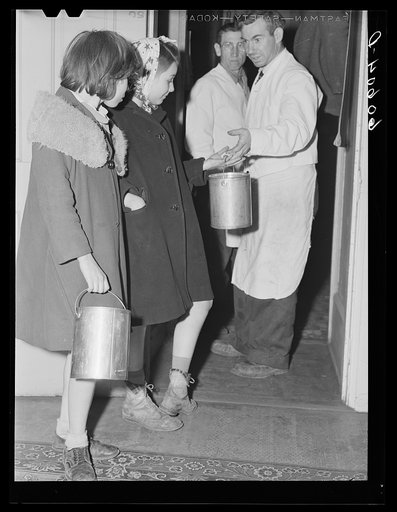Child receiving pail of soup to bring home to her family. Children come to the city mission every evening after twenty-five men have been fed. Dubuque, Iowa