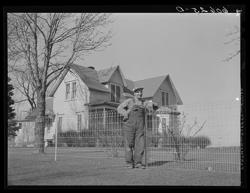 Fred Coulter, Iowa corn farmer, in front of his house. Grundy County, Iowa