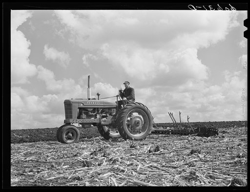 Discing cornfield before planting. Grundy County, Iowa