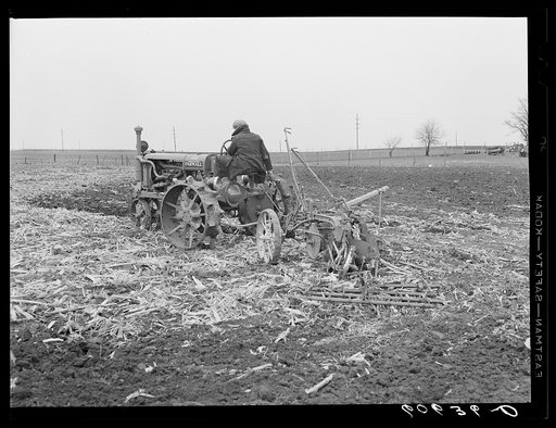 Tractor drawing plow and harrow. Greene County, Iowa