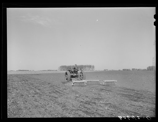 Untitled photo, possibly related to: Breaking up corn stalks before plowing. Grundy County, Iowa