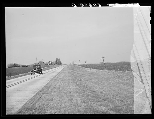 Highway through fertile land of Grundy County, Iowa