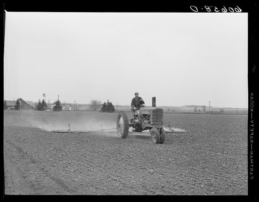 Using spike tooth harrow as drag. Final step before planting corn. Grundy County, Iowa