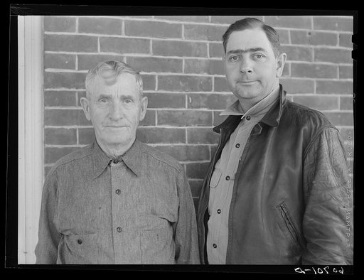 Western Iowa corn farmer and son. Monona County, Iowa