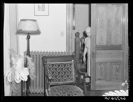 Closing sliding door to parlor. Home in Scranton, Iowa