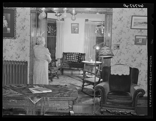 Closing sliding door to little-used parlor. Home in Scranton, Iowa
