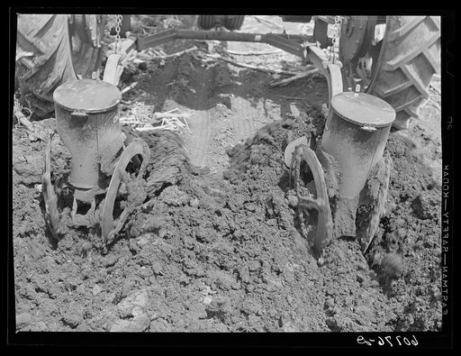 Listing and planting corn with two-row tractor planter. When this method is used the ground need not be plowed up until actual planting begins. Monona County, Iowa