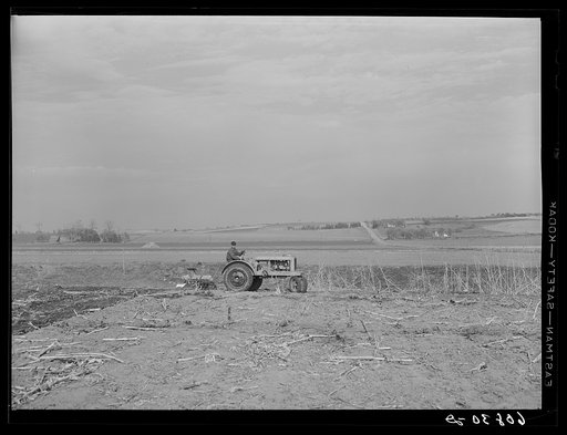 Discing to break up cornstalks before plowing. Greene County, Iowa