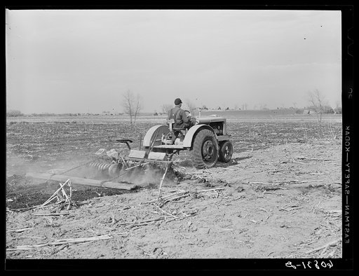 Discing to break up cornstalks before plowing. Greene County, Iowa